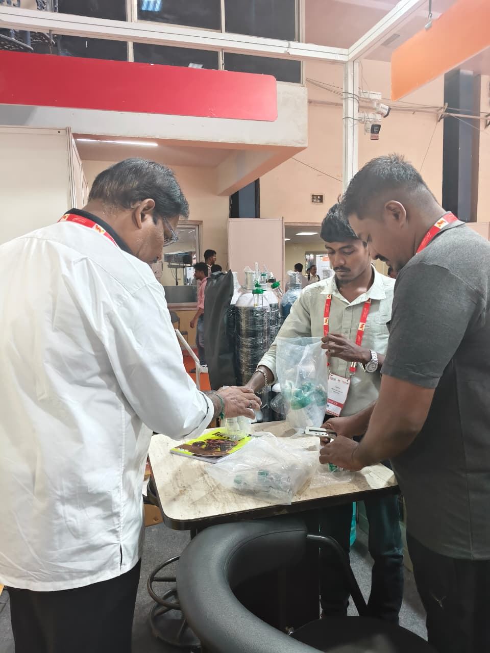Medicall Exhibition - Team assembling oxygen therapy accessories at the stall